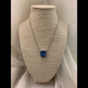 Silver necklace with a beautiful blue crystal